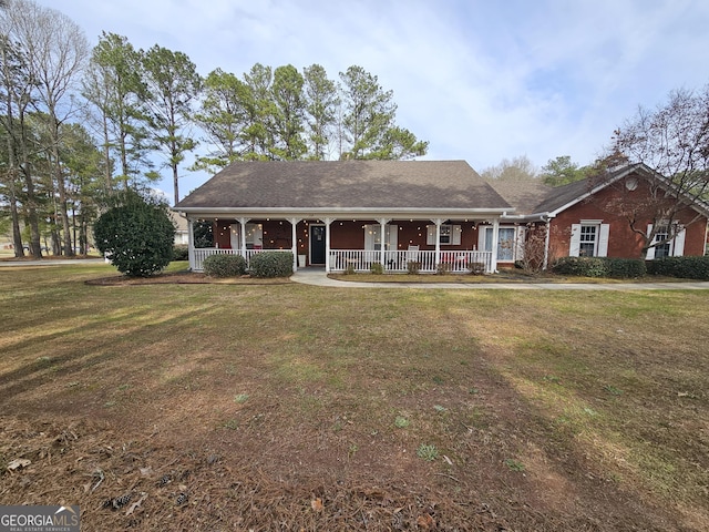 164 Turner Creek Dr, Hampton, GA 30228 - ranch-style house with a porch and a front yard