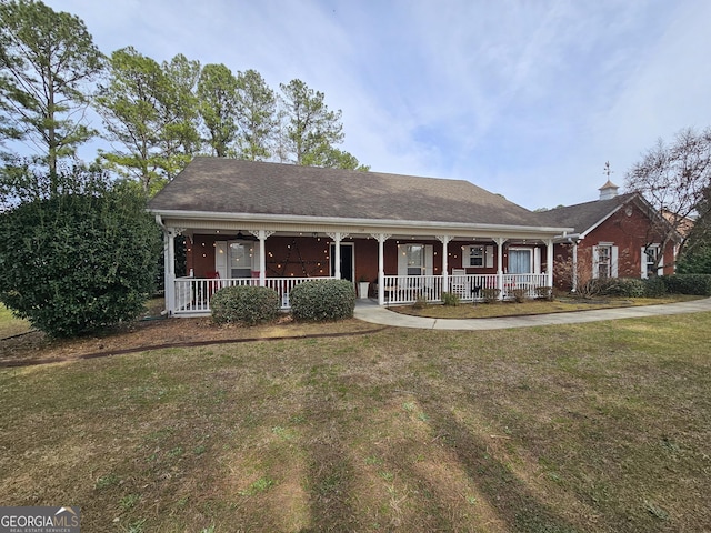 164 Turner Creek Dr, Hampton, GA 30228 - ranch-style home with a porch and a front yard
