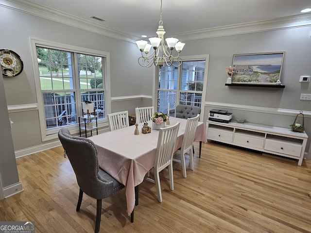200 Chaparral Trce, Tyrone, GA 30290 - dining area with a chandelier, wood finished floors, and ornamental molding
