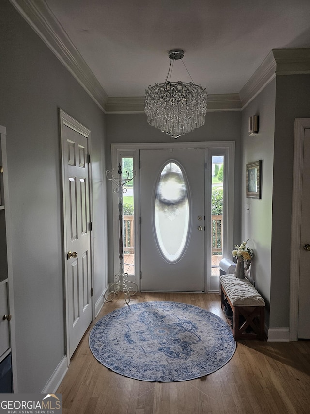 200 Chaparral Trce, Tyrone, GA 30290 - entryway with wood finished floors, a chandelier, and crown molding