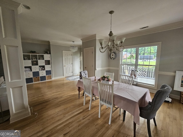 200 Chaparral Trce, Tyrone, GA 30290 - dining area featuring a chandelier, ornamental molding, and wood finished floors