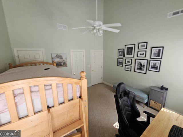 200 Chaparral Trce, Tyrone, GA 30290 - carpeted bedroom with an office area, a towering ceiling, and ceiling fan