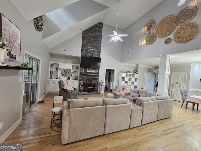 200 Chaparral Trce, Tyrone, GA 30290 - living area featuring a ceiling fan, high vaulted ceiling, wood finished floors, ornate columns, and a stone fireplace