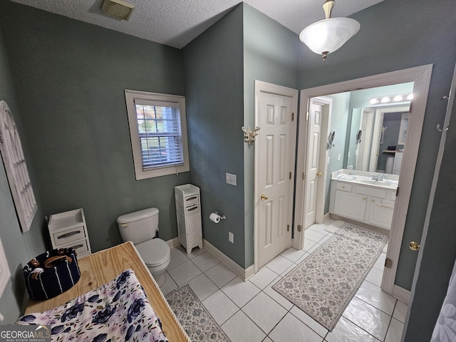 200 Chaparral Trce, Tyrone, GA 30290 - bathroom with vanity, a textured ceiling, and tile patterned flooring