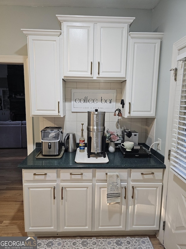 200 Chaparral Trce, Tyrone, GA 30290 - bar featuring decorative backsplash and wood finished floors