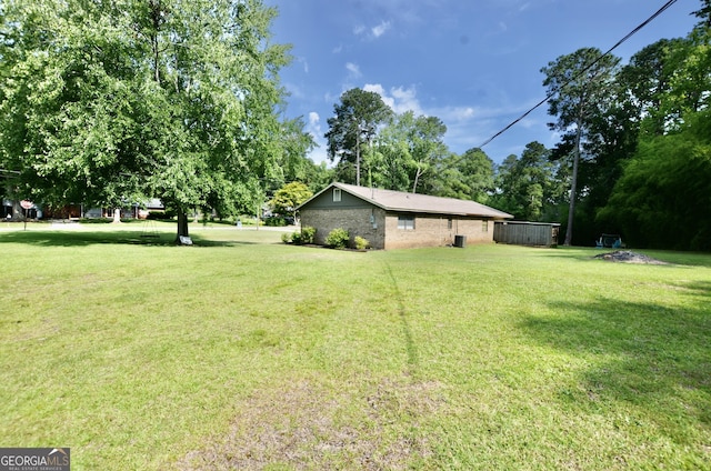 68 Archie Ln, Pine Mountain, GA 31822 - view of green lawn with view of wooded area