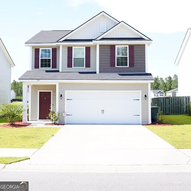93 Brightleaf Cir, Hinesville, GA 31313 - view of front of property featuring a garage, driveway, and board and batten siding