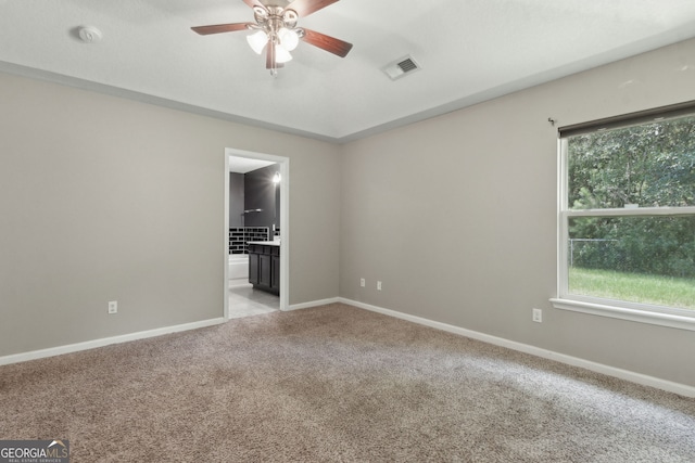 324 Woodbridge Rd, Kingsland, GA 31548 - empty room featuring a ceiling fan, light colored carpet, plenty of natural light, and a smoke detector