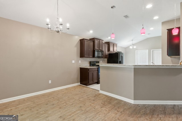 324 Woodbridge Rd, Kingsland, GA 31548 - kitchen with black appliances, a chandelier, lofted ceiling, dark brown cabinets, and light wood-style floors