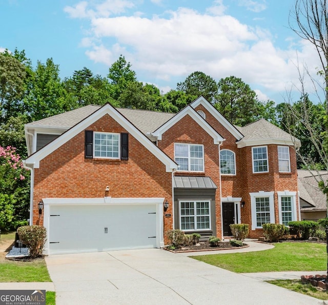2023 Jameson Cir, Lawrenceville, GA 30043 - view of front of property featuring brick siding, concrete driveway, a garage, a front lawn, and roof with shingles