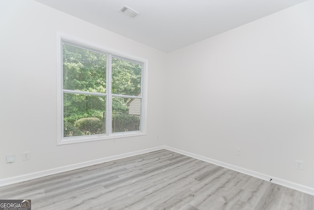 2023 Jameson Cir, Lawrenceville, GA 30043 - spare room with light wood finished floors and baseboards