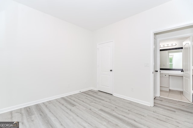 2023 Jameson Cir, Lawrenceville, GA 30043 - unfurnished bedroom with light wood-style flooring and baseboards