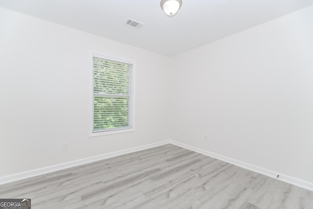 2023 Jameson Cir, Lawrenceville, GA 30043 - unfurnished room featuring light wood-style floors and baseboards