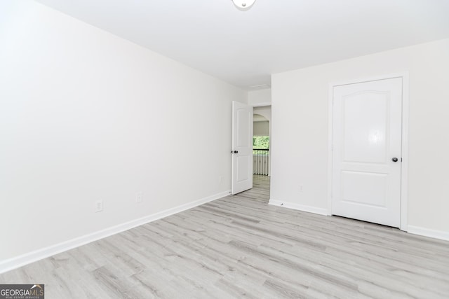 2023 Jameson Cir, Lawrenceville, GA 30043 - unfurnished room with light wood finished floors and baseboards