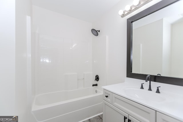 2023 Jameson Cir, Lawrenceville, GA 30043 - bathroom featuring vanity, shower / bath combination, and wood finished floors