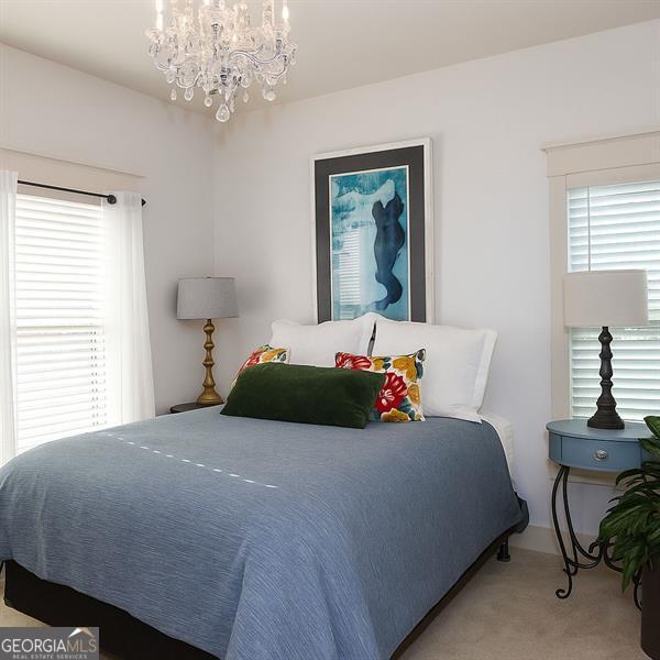 730 Midway, Canton, GA 30114 - bedroom featuring light colored carpet and a chandelier