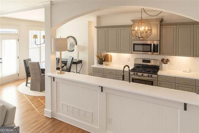 730 Midway, Canton, GA 30114 - kitchen featuring appliances with stainless steel finishes, gray cabinets, a chandelier, and light wood-type flooring
