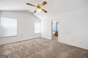 4527 Baker Grove Rd NW, Acworth, GA 30101 - unfurnished bedroom featuring carpet flooring and vaulted ceiling