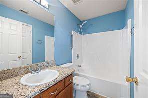 4527 Baker Grove Rd NW, Acworth, GA 30101 - bathroom with vanity and washtub / shower combination