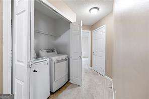 4527 Baker Grove Rd NW, Acworth, GA 30101 - laundry room with washing machine and clothes dryer