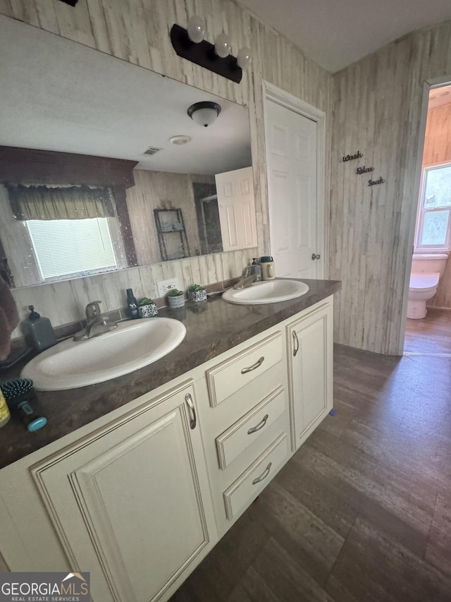 92 Graham Ln, Claxton, GA 30417 - full bath featuring double vanity, a shower, and wood finished floors