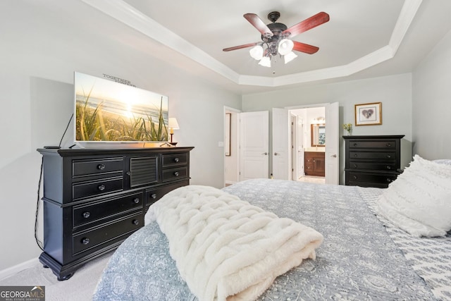 3804 Tattenhall Dr, Cumming, GA 30040 - carpeted bedroom with a raised ceiling, ensuite bath, ceiling fan, and ornamental molding