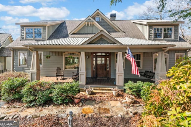 1043 Deer Run Rdg, Jasper, GA 30143 - view of front of property with covered porch, a shingled roof, and a chimney