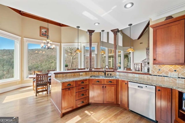 1043 Deer Run Rdg, Jasper, GA 30143 - kitchen featuring dishwasher, a chandelier, brown cabinetry, backsplash, and a peninsula