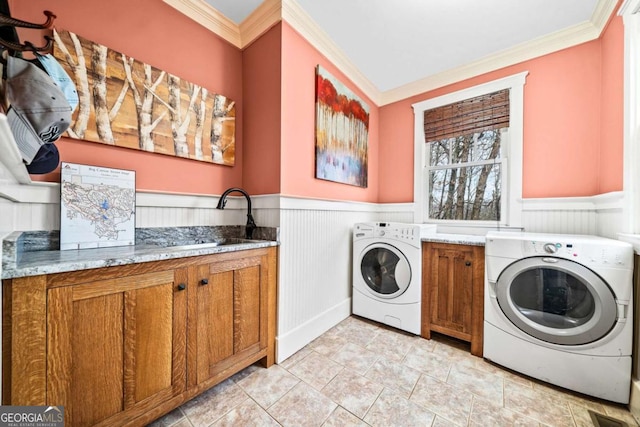 1043 Deer Run Rdg, Jasper, GA 30143 - laundry area with cabinet space, crown molding, a wainscoted wall, and washing machine and dryer