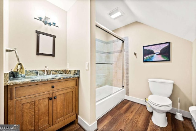 1043 Deer Run Rdg, Jasper, GA 30143 - bathroom featuring wood finished floors, vanity, vaulted ceiling, and bath / shower combo with glass door