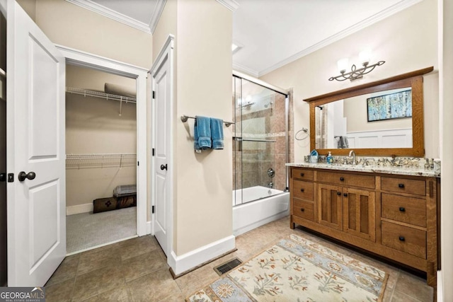 1043 Deer Run Rdg, Jasper, GA 30143 - full bathroom featuring ornamental molding, vanity, combined bath / shower with glass door, tile patterned floors, and a walk in closet