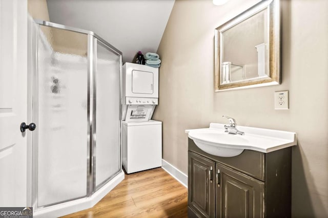 1043 Deer Run Rdg, Jasper, GA 30143 - full bath with stacked washer and clothes dryer, vanity, a shower stall, and wood finished floors