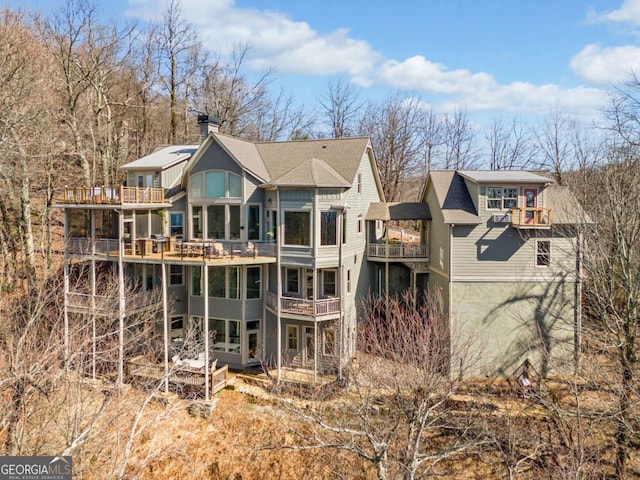 1043 Deer Run Rdg, Jasper, GA 30143 - back of house with a balcony and a chimney