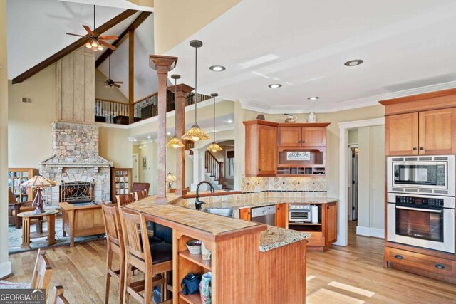 1043 Deer Run Rdg, Jasper, GA 30143 - kitchen with stainless steel appliances, ceiling fan, a peninsula, light wood-type flooring, and recessed lighting