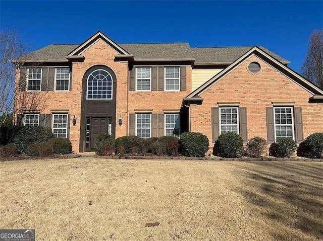 1085 Blackwood Ct, Suwanee, GA 30024 - view of front of home with brick siding and a front lawn
