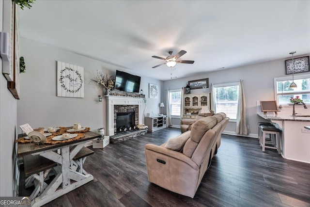 93 Oakdale Way, Temple, GA 30179 - living area with a ceiling fan, dark wood-style floors, and a stone fireplace