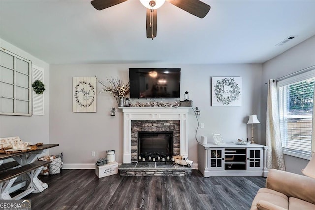 93 Oakdale Way, Temple, GA 30179 - living area featuring a ceiling fan, wood finished floors, and a stone fireplace