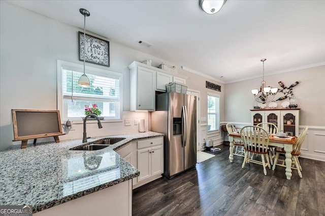 93 Oakdale Way, Temple, GA 30179 - kitchen featuring stainless steel fridge with ice dispenser, dark wood-type flooring, plenty of natural light, wainscoting, and crown molding