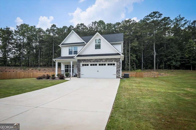 93 Oakdale Way, Temple, GA 30179 - view of front facade with concrete driveway, a front lawn, stone siding, and an attached garage
