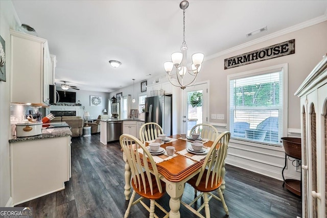93 Oakdale Way, Temple, GA 30179 - dining space with a chandelier, dark wood-type flooring, ornamental molding, and a wainscoted wall