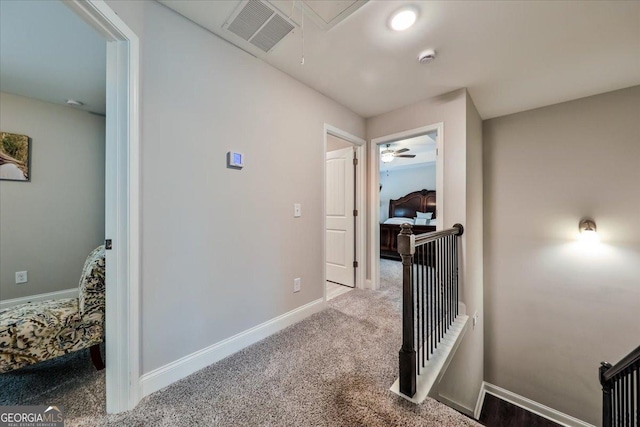 93 Oakdale Way, Temple, GA 30179 - corridor featuring attic access, carpet flooring, and an upstairs landing