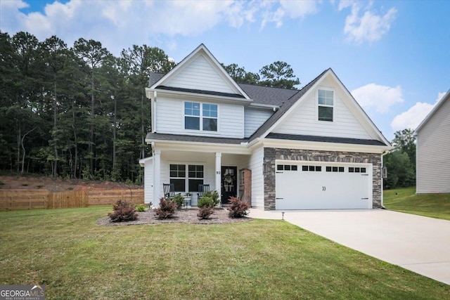 93 Oakdale Way, Temple, GA 30179 - view of front of home featuring a porch, driveway, a garage, and stone siding