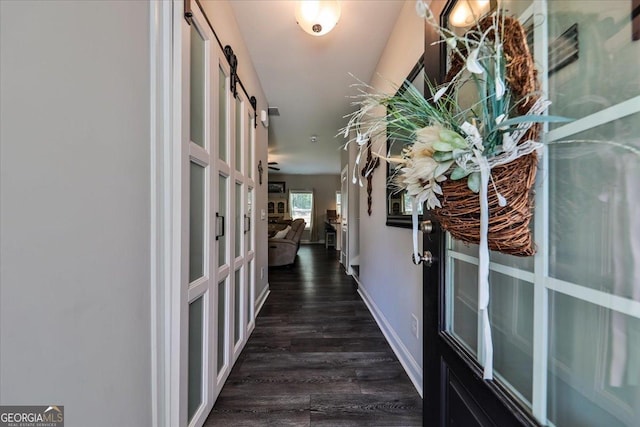 93 Oakdale Way, Temple, GA 30179 - hallway with dark wood-style floors, french doors, and a barn door