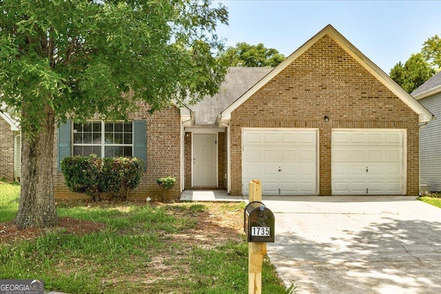 1735 Deer Crossing Cir, Jonesboro, GA 30236 - view of front of house featuring concrete driveway, an attached garage, and brick siding