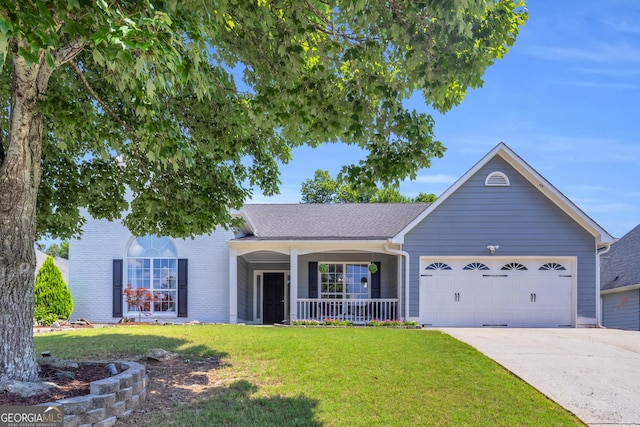 499 Running Doe Ct, Suwanee, GA 30024 - view of front facade with a porch, a garage, a front lawn, and driveway