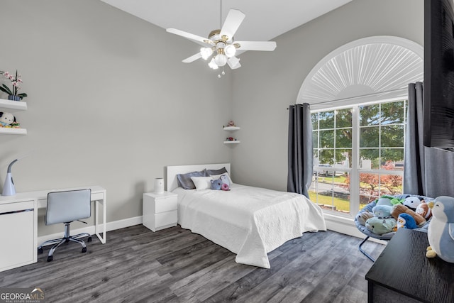 499 Running Doe Ct, Suwanee, GA 30024 - bedroom with dark wood-style flooring, an office area, and a ceiling fan