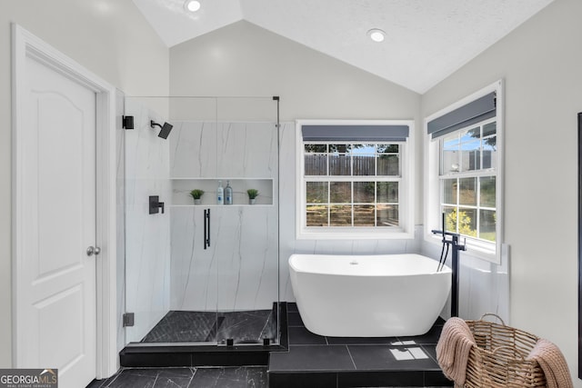 499 Running Doe Ct, Suwanee, GA 30024 - bathroom with vaulted ceiling, a soaking tub, and a marble finish shower