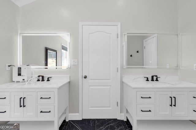 499 Running Doe Ct, Suwanee, GA 30024 - bathroom featuring two vanities and marble look tiles