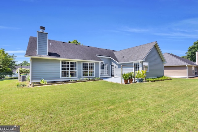 499 Running Doe Ct, Suwanee, GA 30024 - back of property featuring a yard, a patio, and a chimney