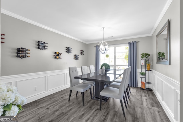 499 Running Doe Ct, Suwanee, GA 30024 - dining area with a chandelier, wood finished floors, ornamental molding, wainscoting, and a decorative wall